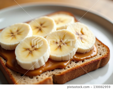 Delicious Slice Bread Topped with Peanut Butter and Banana for Breakfast Food 130082959