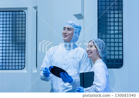 workers working in a factory workers working in a factory 130083340