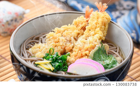 Steaming hot tempura soba noodles - a warming Japanese dish perfect for celebrating New Year's Eve or as part of a winter Japanese meal. Steaming hot tempura soba noodles - a warming Japanese dish perfect for celebrating New Year's Eve or as part of a winter Japanese meal. 130083738
