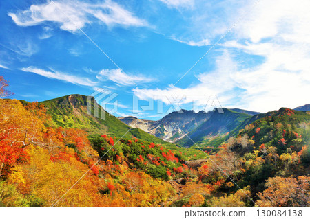 Hokkaido Tokachidake of autumn blue sky and colored leaves 130084138