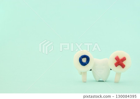 Miniature teeth with crosses and circles Miniature teeth with crosses and circles 130084395