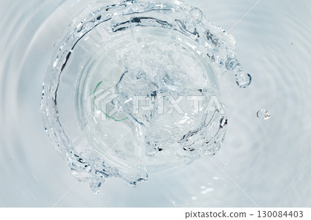 Water blowing out of a pipe. 130084403