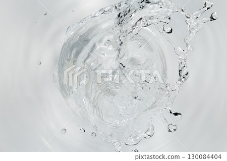 Water blowing out of a pipe. 130084404