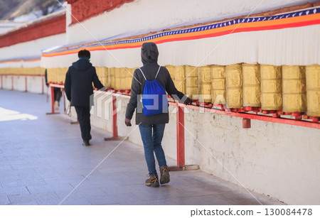 One Tibetan lady Spin the Tibetan Prayer Wheels in Potala place,Lhasa,China 130084478