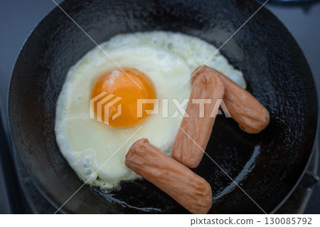 Bake a fried egg in a frying pan Bake a fried egg in a frying pan 130085792