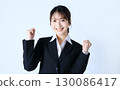 Image of a business woman doing a guts pose 130086417