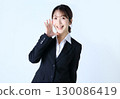 An image of a business woman cheering 130086419