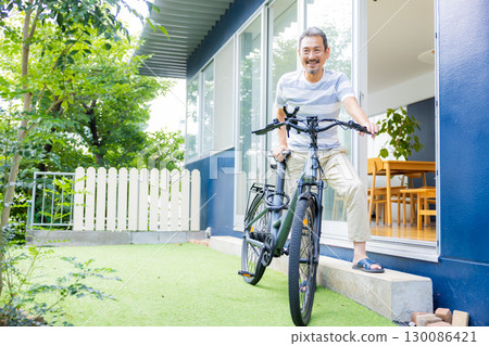 Middle-aged man doing bicycle maintenance Middle-aged man doing bicycle maintenance 130086421