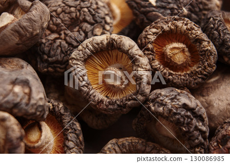 Dried shiitake mushrooms. Raw culinary ingredient. Macro shot 130086985
