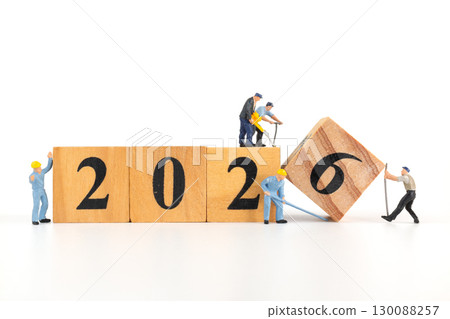 Miniature Workers Building 2026 on Wooden Blocks 130088257