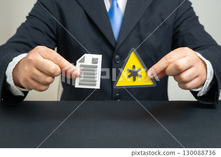 The businessman points out hidden terms in the contract. Hidden terms and loopholes in the text of the agreement, risks for investors and legal consequences. 130088736