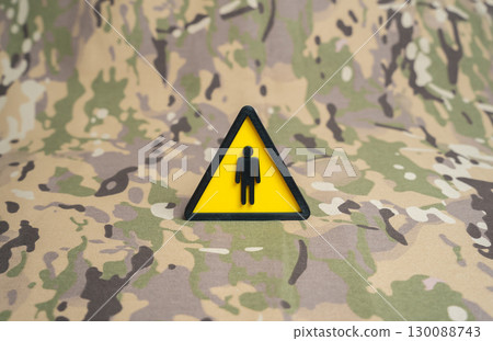 Symbol of a man on a military background. Recruitment and training of military personnel, strengthening defense forces and career opportunities in the army 130088743