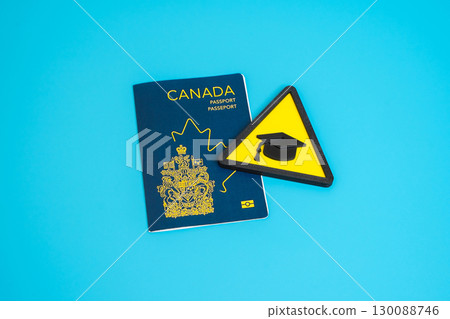 Canadian passport and university cap symbol. Foreign education, study programs. Exchange students, academic mobility and global learning opportunities 130088746