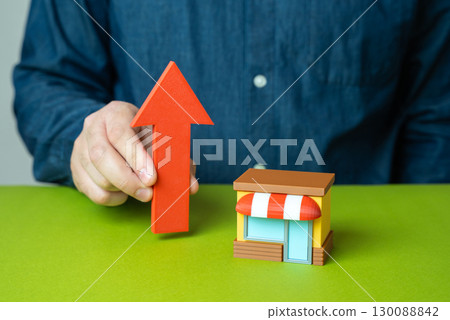 Business and a red arrow pointing up. Growth indicators, revenue rise, success metrics, stock market gains, financial progress 130088842