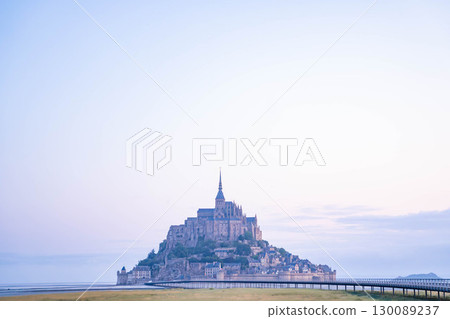 Panoramic view of Mont Saint-Michel at sunrise (French World Heritage Site) 130089237