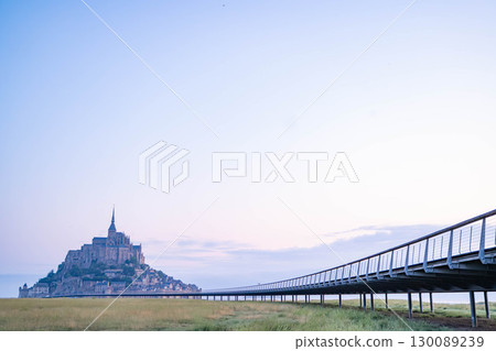 Panoramic view of Mont Saint-Michel at sunrise (French World Heritage Site) 130089239