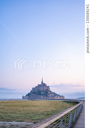 Panoramic view of Mont Saint-Michel at sunrise (French World Heritage Site) 130089241