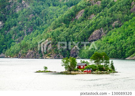 Fjord landscape with hytte on isle, Norway 130089320