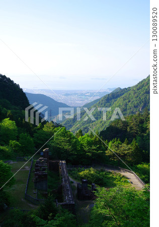 Besshi Copper Mine, Niihama City, Ehime Prefecture. View of the cableway base, ore storage facility, and the city. 130089520