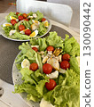 fresh salad with tomatoes 130090442