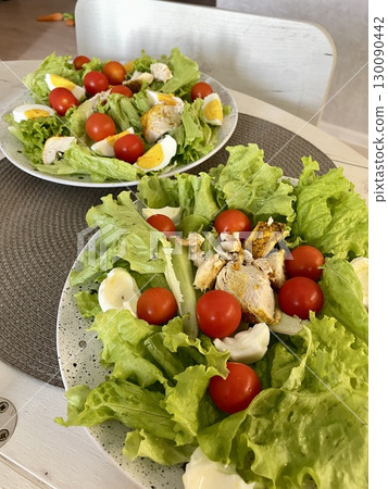 fresh salad with tomatoes 130090442