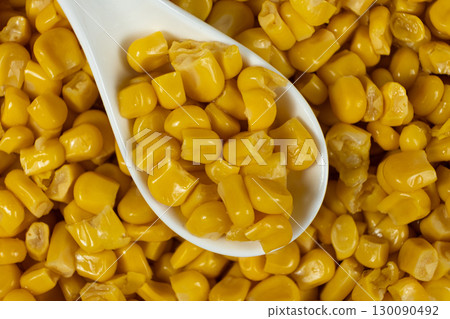 Close-Up Of Sweet Canned Corn Kernels In Spoon. Close-Up Of Sweet Canned Corn Kernels In Spoon. 130090492