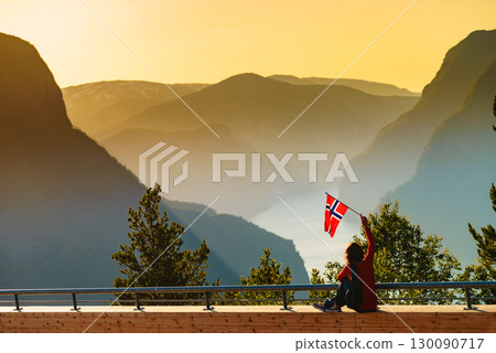 Tourist enjoy fjord view on Stegastein viewpoint Norway Tourist enjoy fjord view on Stegastein viewpoint Norway 130090717