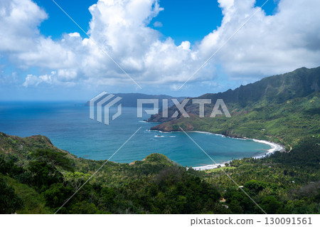 Coastal cliffs and turquoise bay near Puamau, Hiva Oa, Marquesas Islands, French Polynesia 130091561