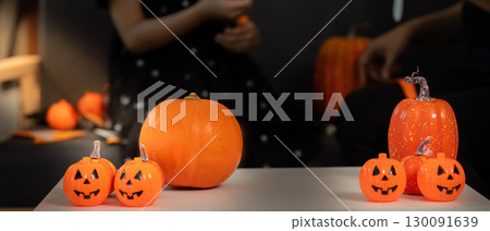 Halloween Decorations. A table filled with festive pumpkins and decorations for Halloween. Halloween Decorations. A table filled with festive pumpkins and decorations for Halloween. 130091639