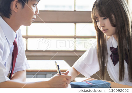Students studying in classroom 130092002