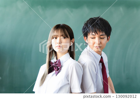 Men and women wearing earphones in each ear Men and women wearing earphones in each ear 130092012