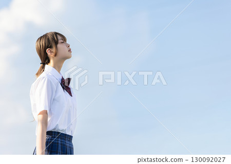 School girls looking up at the sky School girls looking up at the sky 130092027