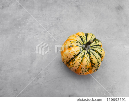 Sweet dumpling squash resting on gray background for autumn festivities 130092391