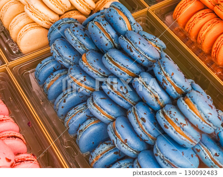 Delicious blue macarons filling pastry shop display in france 130092483
