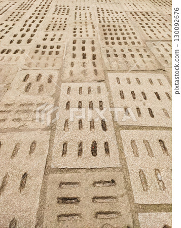 Stone pavement with grooves creating a unique pattern in cesky krumlov 130092676