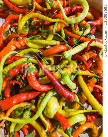 Colorful chili peppers creating a vibrant culinary display 130092699