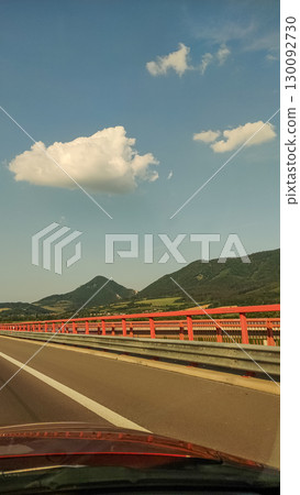 Driving on highway bridge with scenic mountain view in slovakia Driving on highway bridge with scenic mountain view in slovakia 130092730