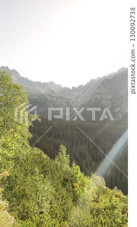 Sunbeam illuminating mengusovska valley in the high tatras mountains 130092738