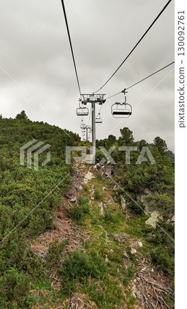 Chairlift ascending mountainside in high tatras, slovakia 130092761