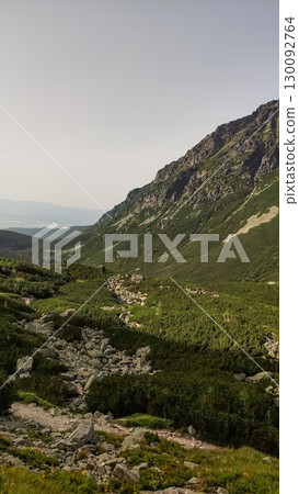 Hiking trail winding through the majestic high tatras mountains in slovakia 130092764