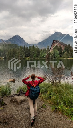 Tourist walking near strbske pleso in high tatras mountains, slovakia 130092766