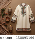 White thobe decorated with floral patterns, placed near incense burners and flowers, suggesting preparations for eid al fitr celebrations Uraza Bayram 130093199