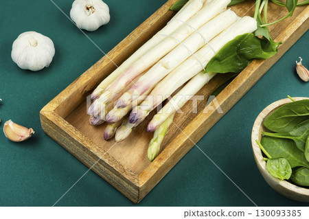 Bunches of fresh white asparagus on a table. 130093385