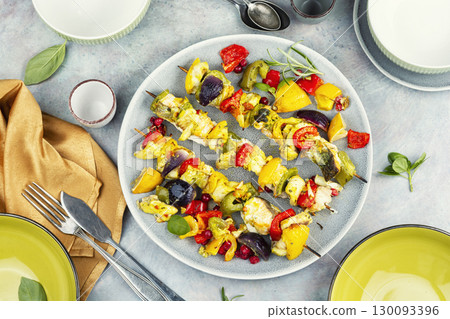 Fish skewers with vegetables for a delicious barbecue. 130093396