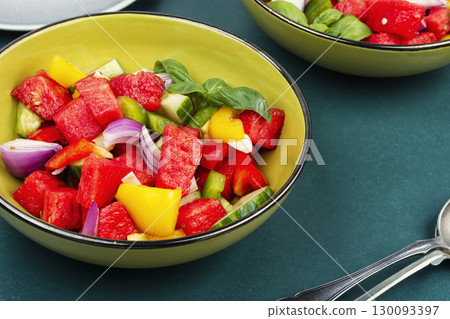 Vegetarian watermelon salad bowl with cucumber. Vegetarian watermelon salad bowl with cucumber. 130093397