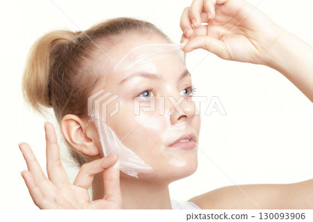 Girl woman in facial peel off mask. Skin care. Girl woman in facial peel off mask. Skin care. 130093906