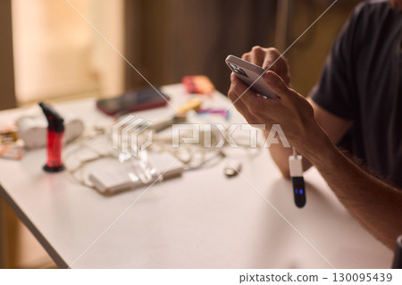 man using otg usb with her mobile phone to copy photos man using otg usb with her mobile phone to copy photos 130095439