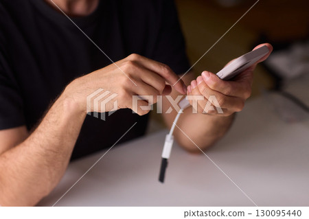 man using otg usb with her mobile phone to copy photos man using otg usb with her mobile phone to copy photos 130095440