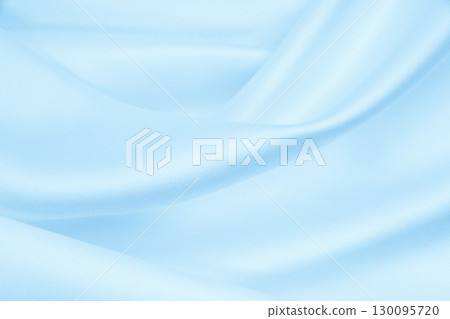Smooth elegant blue silk or satin luxury cloth texture as abstract background. Luxurious background design 130095720