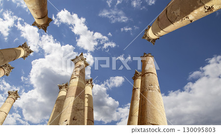 Roman Columns in the Jordanian city of Jerash (Gerasa of Antiquity), capital and largest city of Jerash Governorate, Jordan. Against the background of a beautiful sky with clouds 130095803